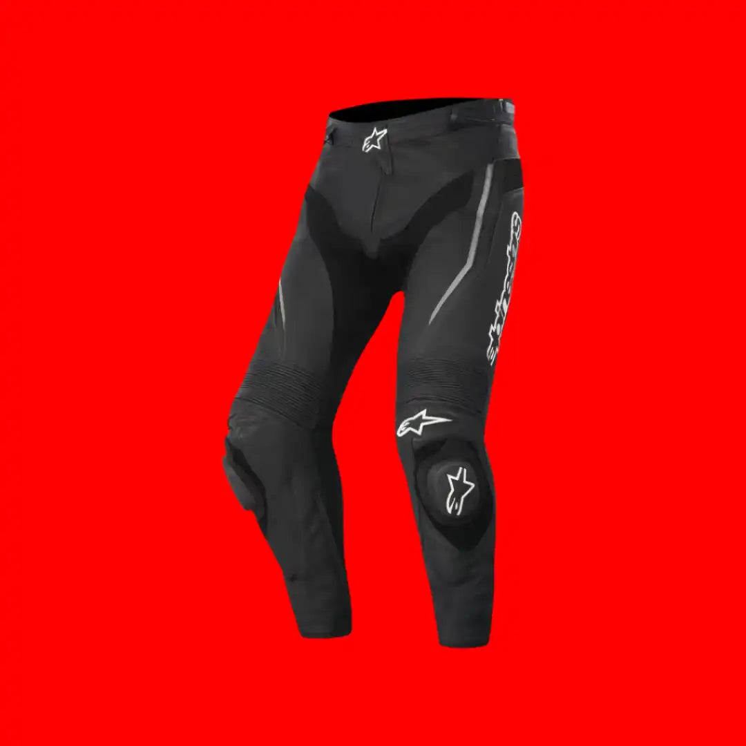 Black leather motorcycle racing pants with Alpinestars logos and protective padding.