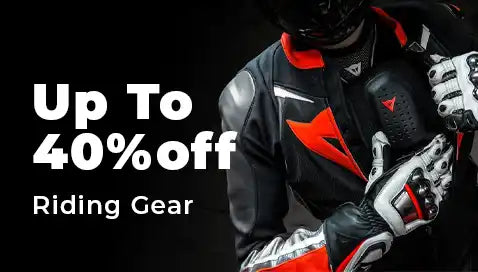 Black motorcycle jacket with red accents and matching riding gloves shown in a promotional sale advertisement.