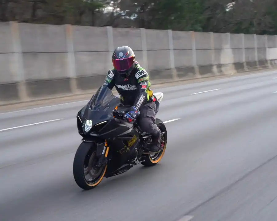 Black motorcycle with rider.
