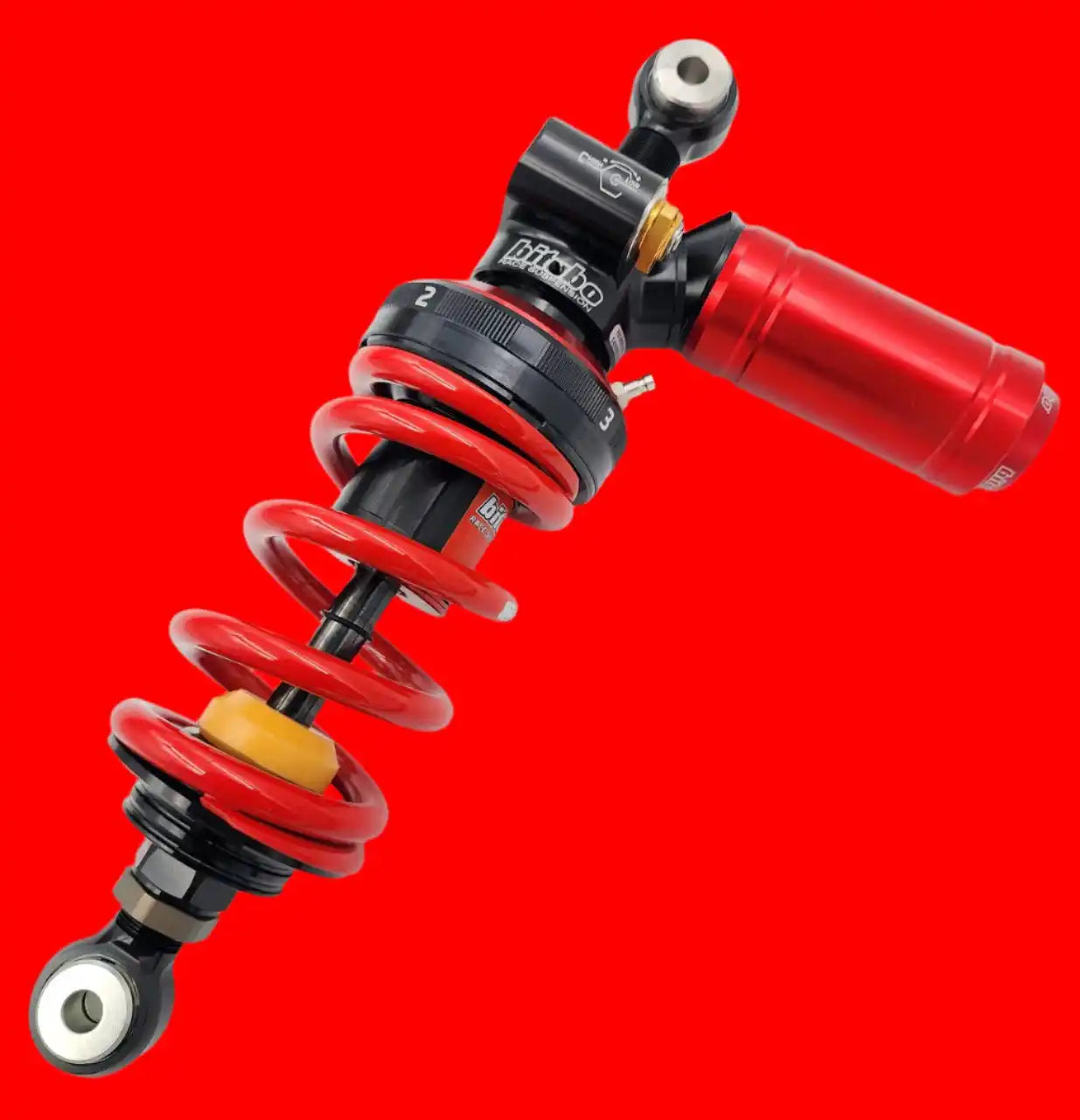 Red and black motorcycle shock absorber with coil spring.